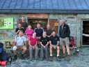 Odyssey/An early start from the final refuge - Day 4.  Refuge des Estagnous at 7,408ft; Rear - Dan Higgins; Seated rear - Marc Reynolds, Alison Draper, Jonathan White, Tomo Tomlinson; Seated front - Roland Lee, Karine Rodgers, Anita Kelly, Max Weedon; Standing - Guide John Howie