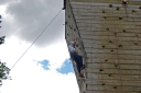 Summer Camp/Cdt Turner N, having conquered the flat wall, moving onto the overhanging wall